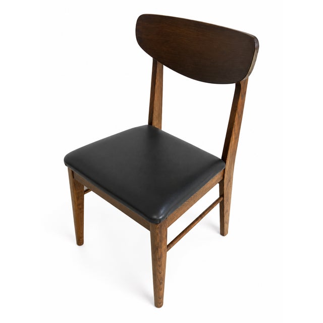 DESCRIPTION: A beautiful set of four (4) vintage mid century modern walnut dining chairs featuring sculpted curved...