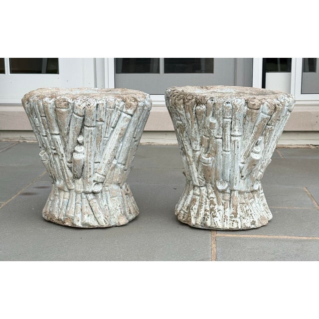 A striking pair of vintage 1960s or 70s sculptural cast stone planters featuring an intricate faux bois / bundled reed...
