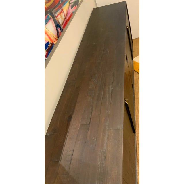 Stylish Organic Modern Dark Brown Finished Reclaimed Pine Sideboard, four doors reveling two shelves, elongated warm brass...