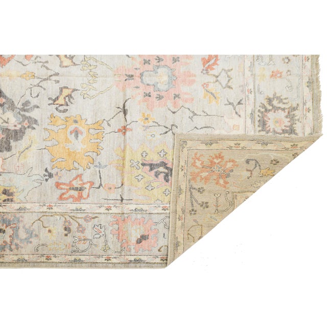 Transform your space with the subtle elegance of this Hand-Knotted Modern Oushak Style Rug. It beautifully combines...