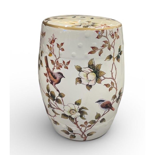 this elegant ceramic garden stool, Featuring a classic drum-shaped silhouette, this piece is adorned with a delicate,...