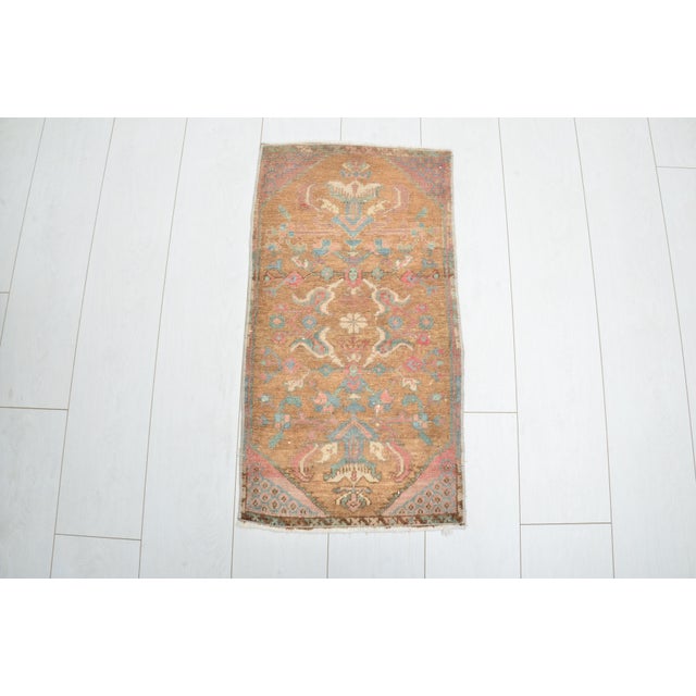 This is a vintage Turkish nomadic wool rug. The piece was handmade in the 1960s.