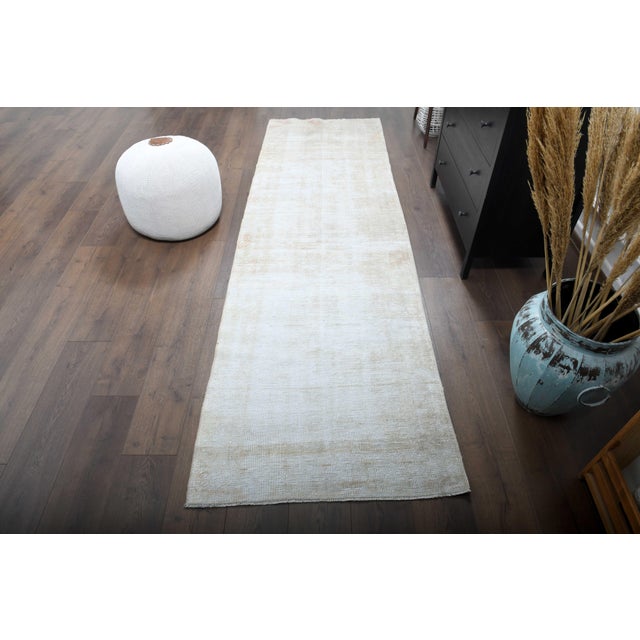 Vintage Hand-Knotted area rug is a semi-antique vintage beige area rug. The '70s Eastern region of Anatolian's unique rug...
