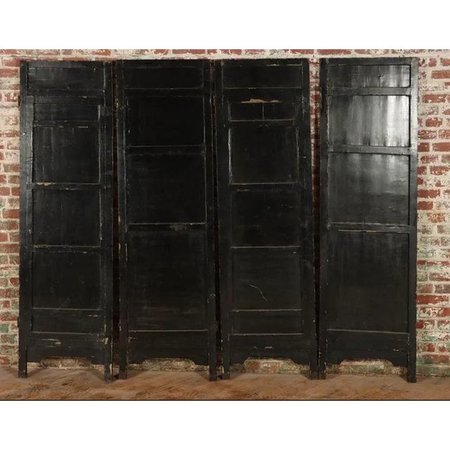 Very functional and very chic. A circa 1900 room divider screen with four wooden lacquered panels decorated with gold...