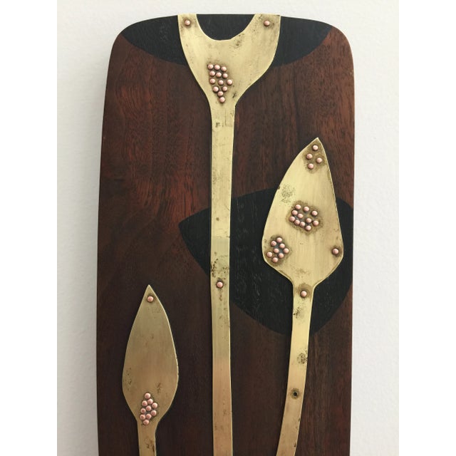 Mid-Century modern wall sculpture made of brass, copper, and wood. A few copper nail heads are missing but otherwise in...
