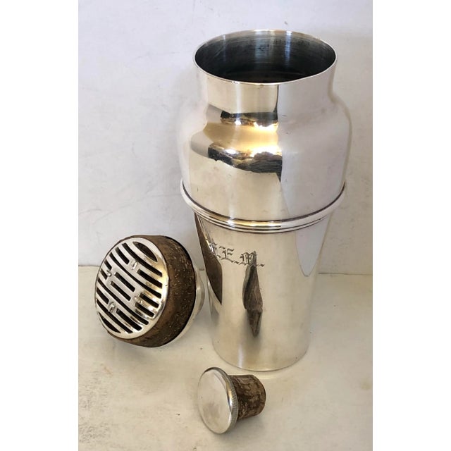Meriden was one of the best silversmiths of the time. This incredible cocktail shaker has the original cork lining on the...