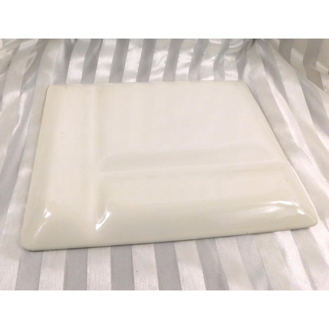 This is a cream and green divided serving dish that is not marked. The person I bought it from said it was Johnson...