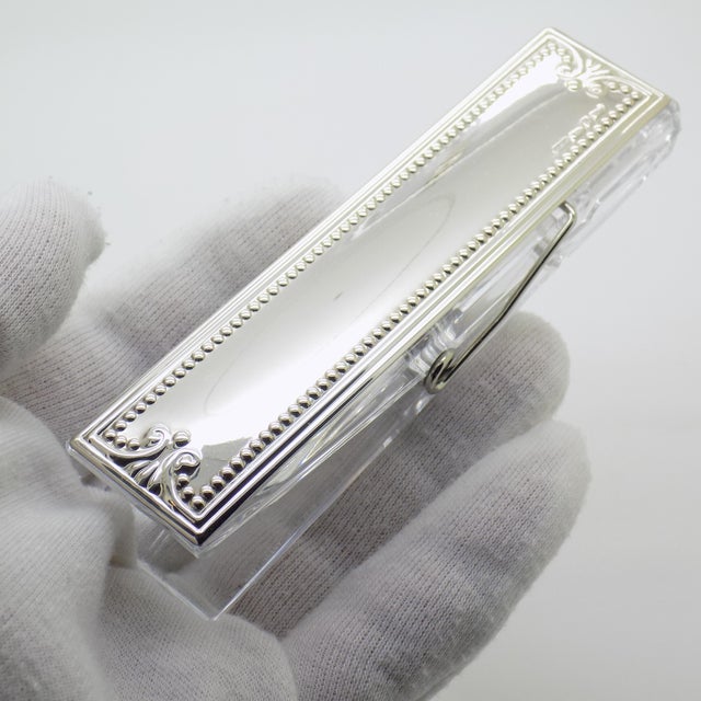 Refined vintage desk accessory in the form of a binder clip, handmade in Italy between the 1980s and 1990s using laminated...