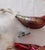 This is a set of three vintage Christmas mercury glass bird ornaments. Each ornament features real feather tails and comes...