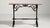 A classic French bistro table with an ornate cast iron base and compact top, designed for durability and frequent use. The...