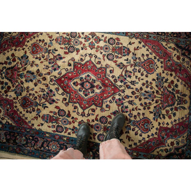 :: Center medallion atop a rare,, and highly sought after ivory ground for the type covered in blossomed plants and floral...