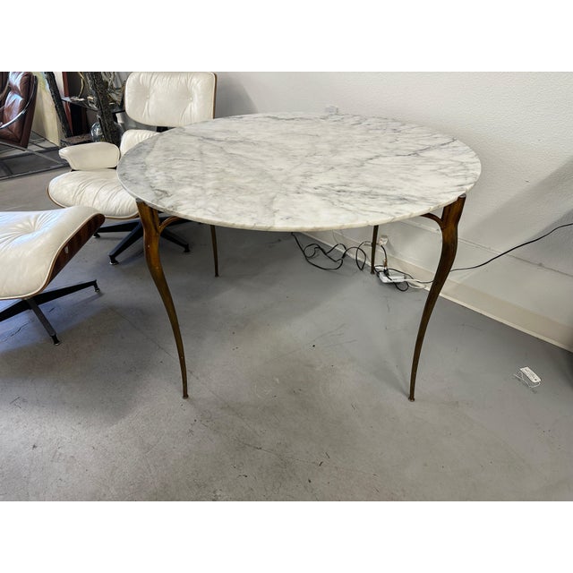 A wonderful Italian Gilt Aluminum and Marble dining table suitable in a Kitchen or small dining room. Very much...