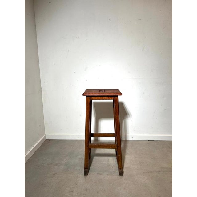 Authentic vintage wooden bar stool with a simple, functional design and beautiful aged patina. Crafted from solid wood,...