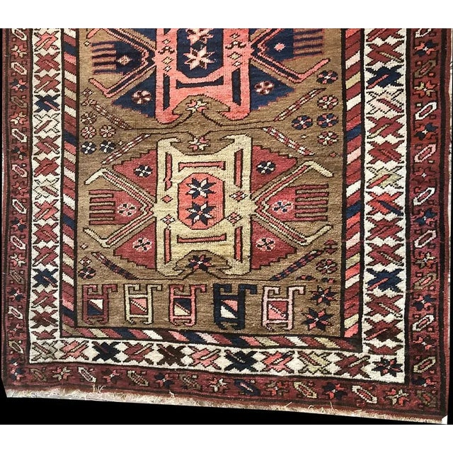 An authentic turn of a 20th century wool on wool Caucasian Karabagh runner. Folks who are looking for a decorative...