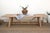 Ten feet of reclaimed wood on a trestle base built the way farmhouse tables have been built for centuries: two angled...