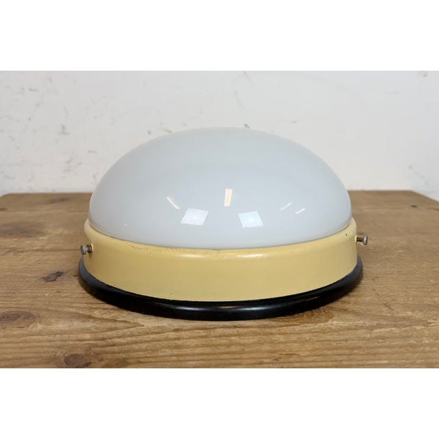 Industrial wall or ceiling lamp made in former Czechoslovakia during the 1950s. Was used in factory offices and corridors....