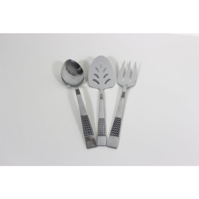 Set of 3 stainless steel serving utensils by Nasco in the Aztec Scrolls pattern from the sixties. Stamped on the back,...