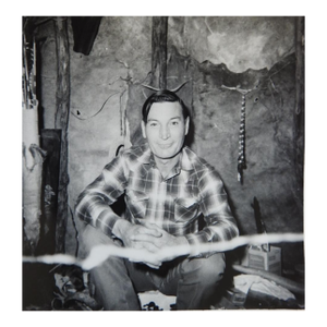 1970 Snapshot Photograph of Man Inside Native American Shelter