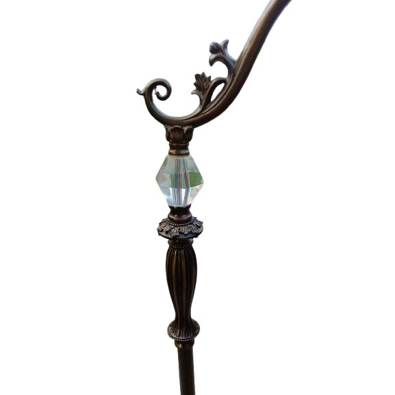 The product is a pair of vintage Art Nouveau style floor lamps with bell Tiffany lamp shades adorned with crystal tassels....