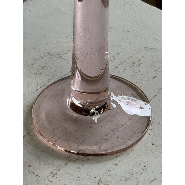 This vintage pink glass large candle holder exudes elegance and charm with its soft, rosy hue. Its sizable design makes it...
