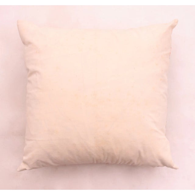 Circa 1940s hand painted and hand embroidered cotton pillow with beach scene woman in canoe with umbrella. Slight wear.