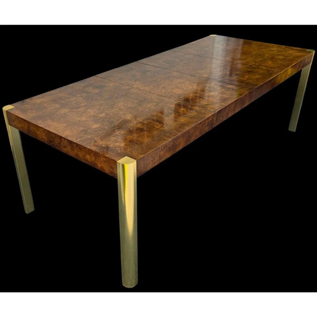 This Mid-Century Burlwood and Brass Dining Table by Century Furniture beautifully reflects the confident luxury of mid-...