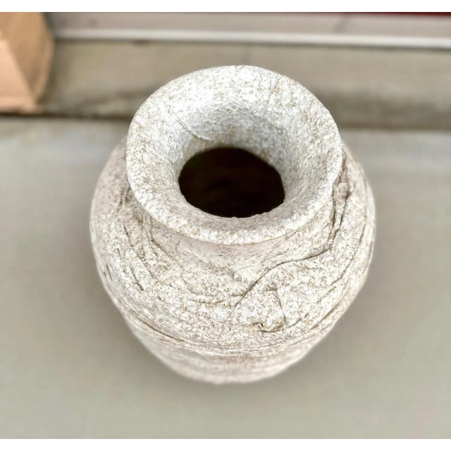 Unique Layered Gauze wrapped in plaster and layered around the vase. In a neutral cream and tan mixture of color. Great...