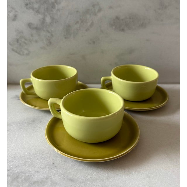Set of 3 (6 total pieces) mid century Russel Wright coffee cups and saucers in two different shades of light green....