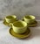 Set of 3 (6 total pieces) mid century Russel Wright coffee cups and saucers in two different shades of light green....