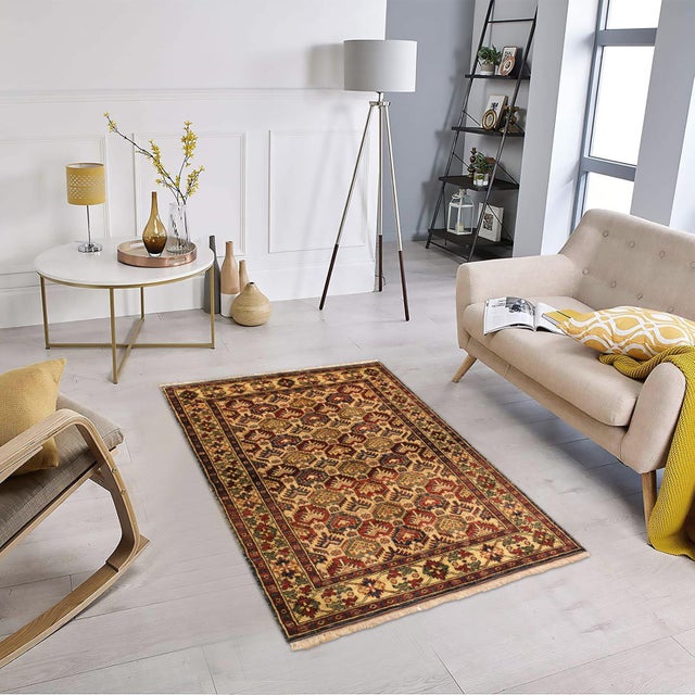 Enhance your home with this exquisite hand-knotted Super Kazak rug, crafted from fine hand-spun wool and dyed with all-...