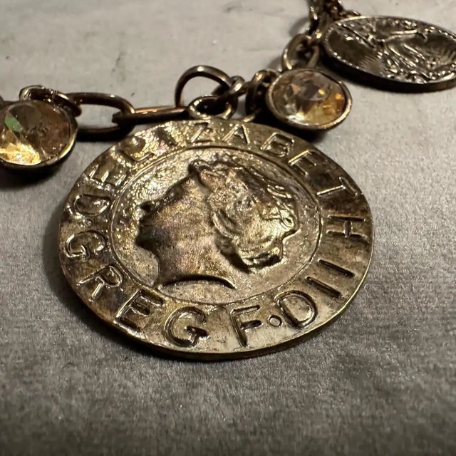 This stunning Italian-inspired costume jewelry necklace exudes timeless elegance and bold sophistication. Crafted with a...