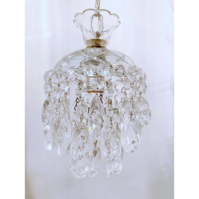 This is a dome layered chandelier with cut-glass dish, octagon chain and 30% leaded Swedish cut crystal drops. It has 1...