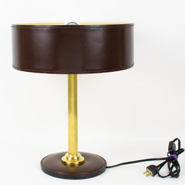 This stunning table lamp was designed by French designer Jacques Adnet (1901-1984). This classical hickory brown color...