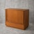 with its warm teak grain, minimalist proportions and functional Danish design, it works equally well as a cocktail...