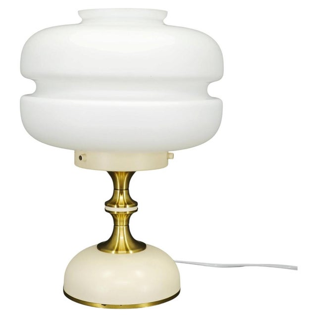 Original napako table lamp manufactured in czechoslovakia during the 1970s. This refined modernist design combines a...