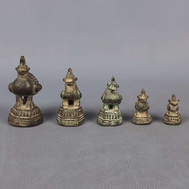 A fascinating lot of 5 antique scale weights, crafted entirely of bronze. These pieces are a classic example of southeast...