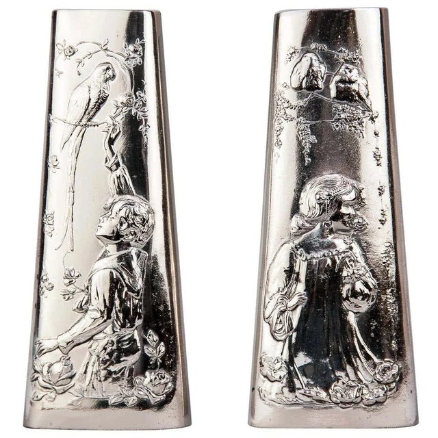 A pair of Jugendstil Alpaca vases, circa 1908s Polished and stove enameled Beautiful children with bird's Motivs on both...