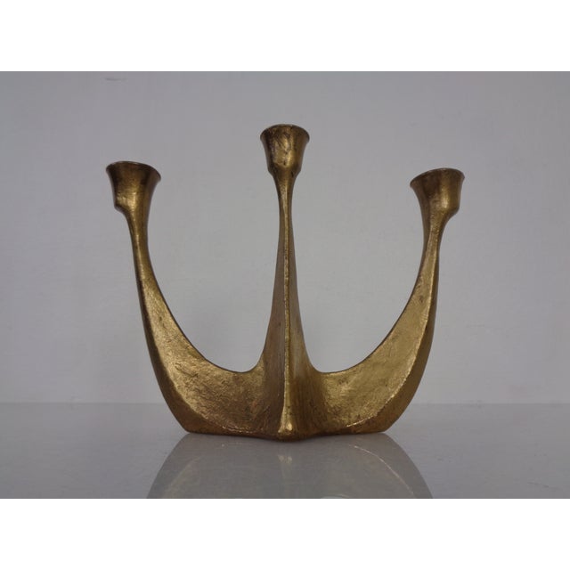 Sculptural bronze candlestick for 3 candles from the 1960s.