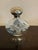 Vintage Nina Ricci L’Air du Temps perfume empty bottle, featuring the iconic Lalique dove motif on clear glass and an...