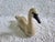 A rustic wooden white swan figurine measuring 7" l x 4 3/4" h x 2 1/4" w. It would look lovely in a traditional, rustic or...
