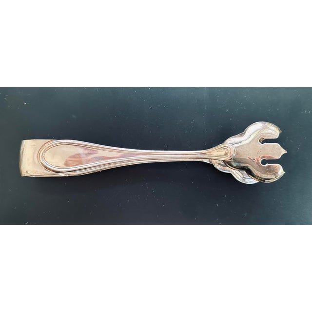 Vintage silver plate ice tongs. 7" long, 1.5" wide. Very good condition.