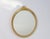 Vintage golden oval ribbon mirror from the 60's made out of wood. It has a maker's mark on the back from the Dutch brand...