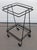 Vintage Mathieu Matégot style mid century modern iron 2 tier rolling bar cart. The cart has 2 removable masonite shelves...