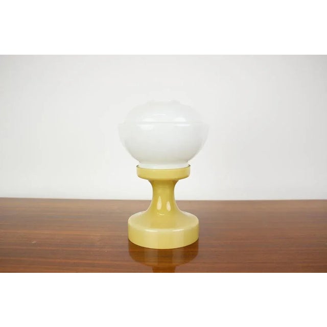Good condition, rewired US plug adapter included. This piece is attributed to the mentioned designer/maker. It has no...