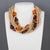 Angela Caputi created this elegant resin-beaded choker necklace in Italy. The piece features an oversized multi-strand...