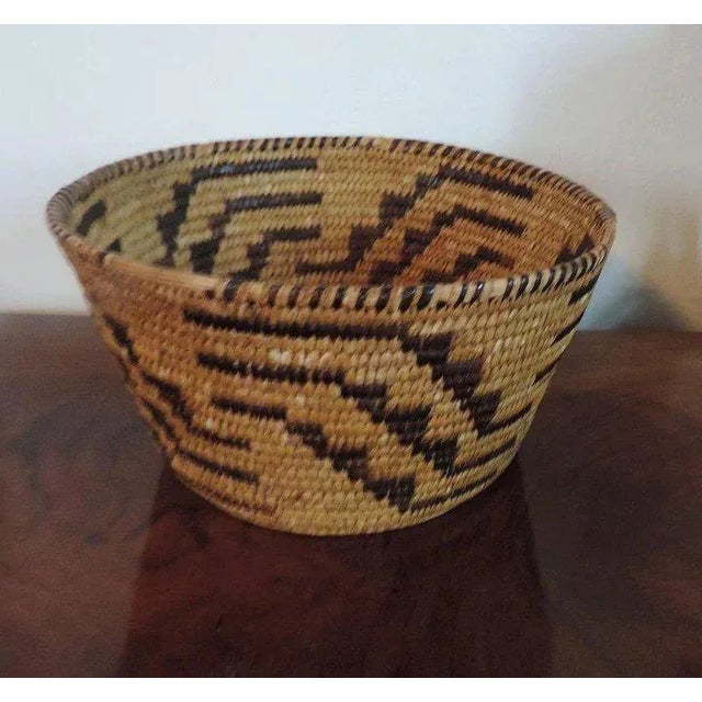 A beautiful late 19th c. Native American style basket decorated with repeating geometric design. Good quality and tight...
