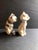 Interesting set of salt and pepper shakers in the shape of Siamese cats. Made of porcelain and with included stoppers.Made...