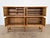 This tall oak sideboard was produced by Axel O. Røck for Ottrup Møbelfabrik in Denmark, dated 18 November 1963 by the...