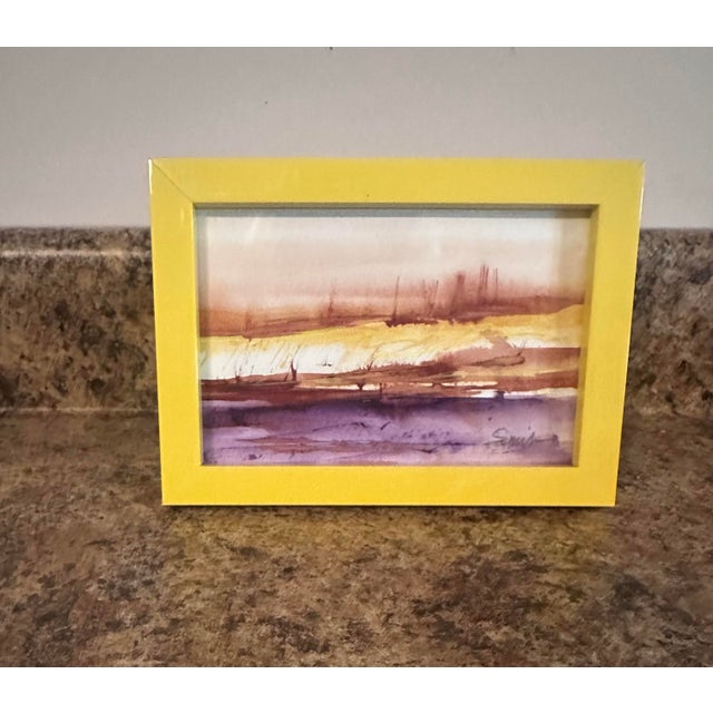 Framed abstracted landscape in recycled yellow frame.