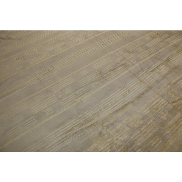 Late 20th century part silk part wool Tibetan carpet in warm brown and gold hues. Professionally Cleaned and personally...